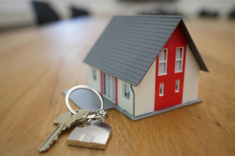 Model house with key on table